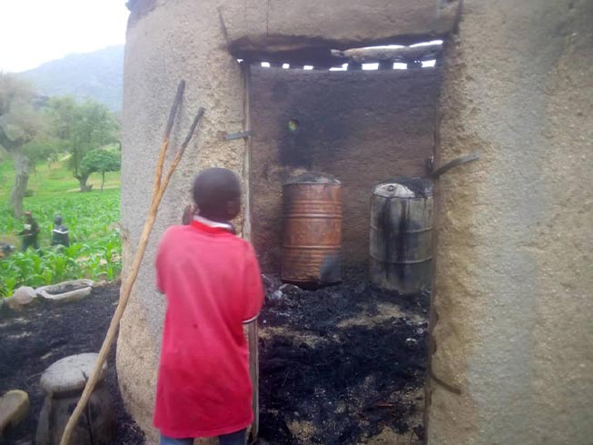 Boy returns to burnt out home in Christian village ransacked by Boko Haram