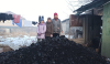 A Christian family in Kyrgyzstan stood next to coal